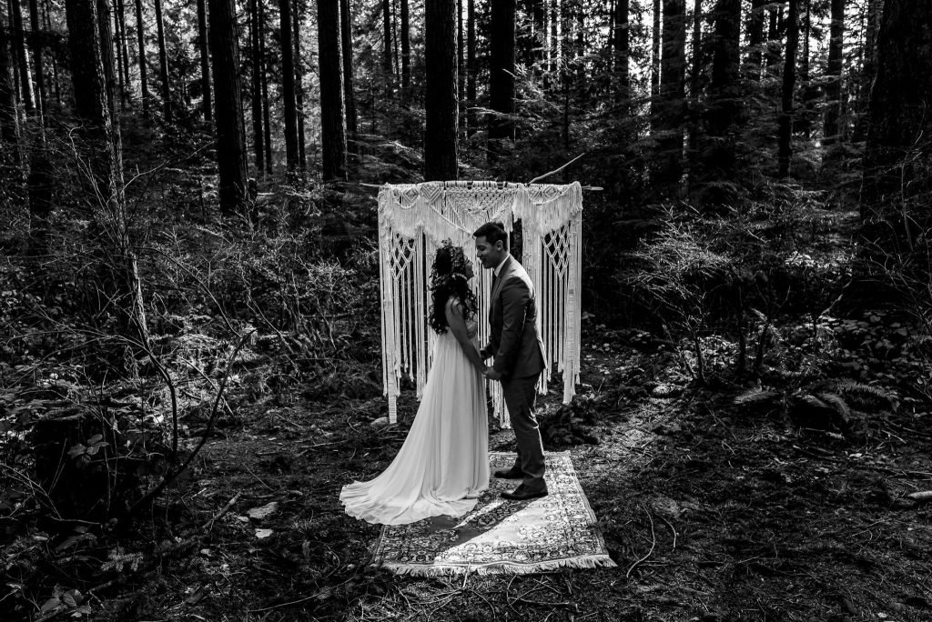 Boho inspired couple in their forest elopement.