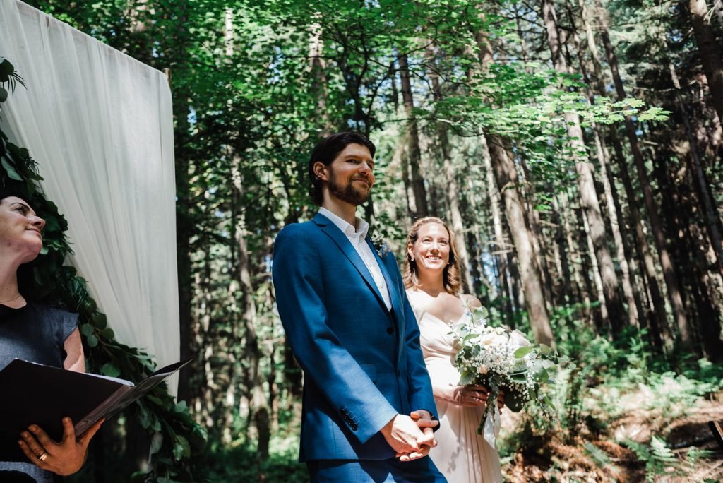 Bride and groom say their vows during intimate elopement in Stanley park 