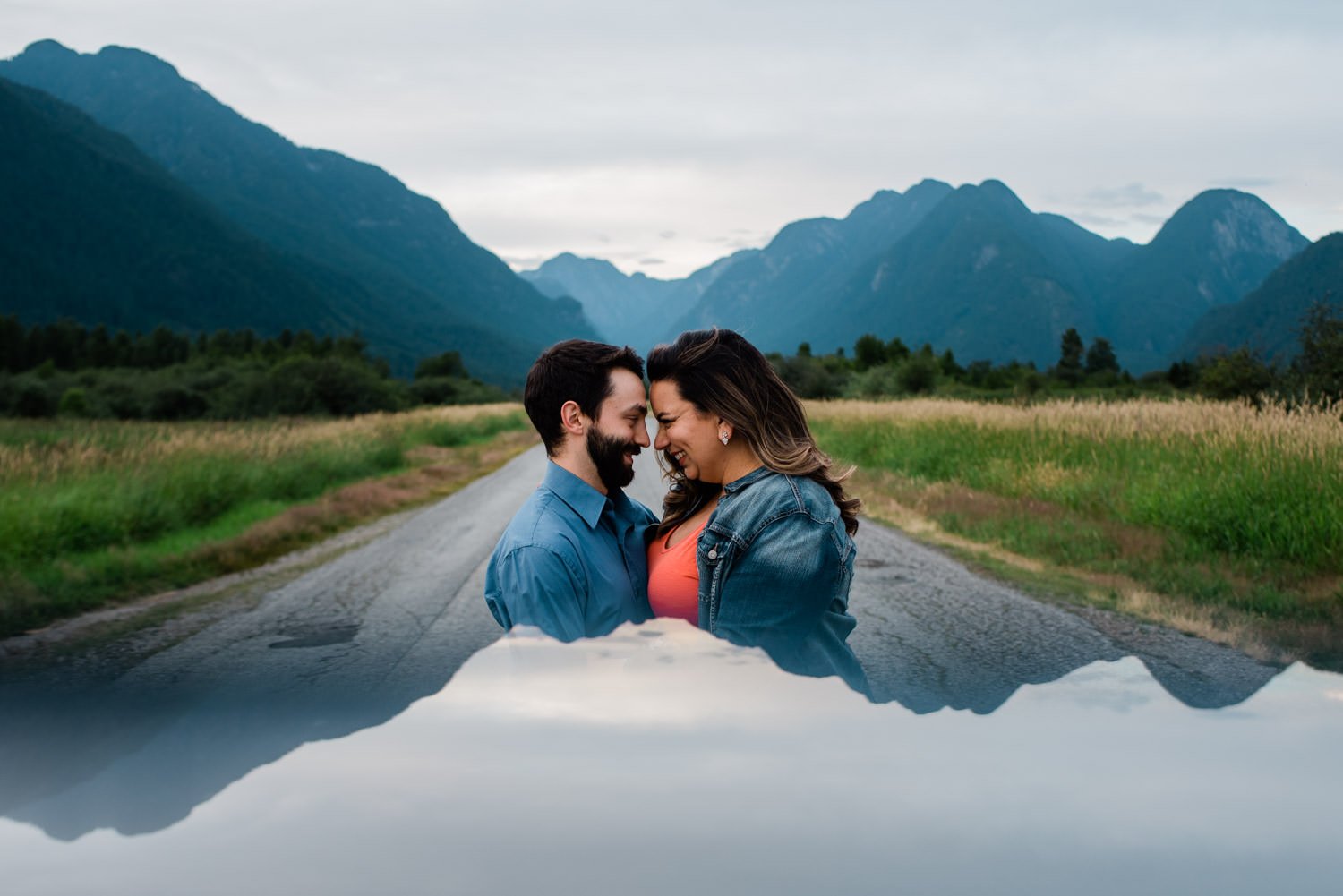 Couple in front of mountains during engagement session at Pitt Lake, BC.