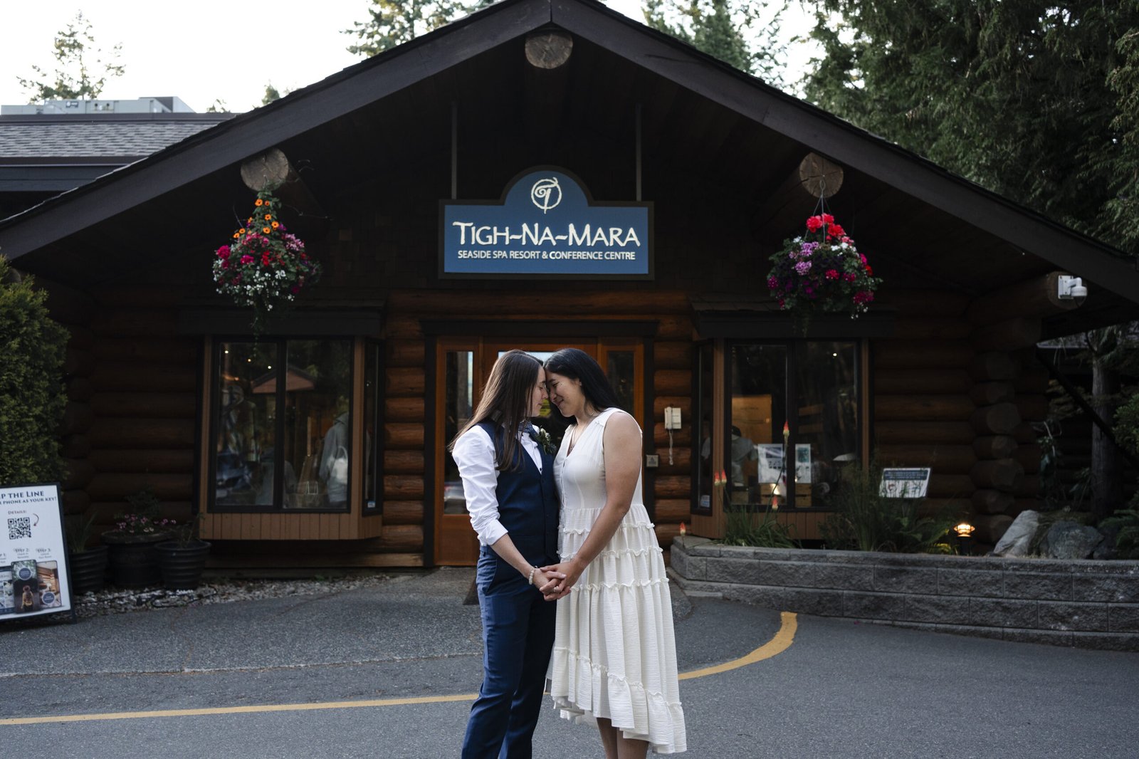 Tigh-Na-Mara couple in front of lodge